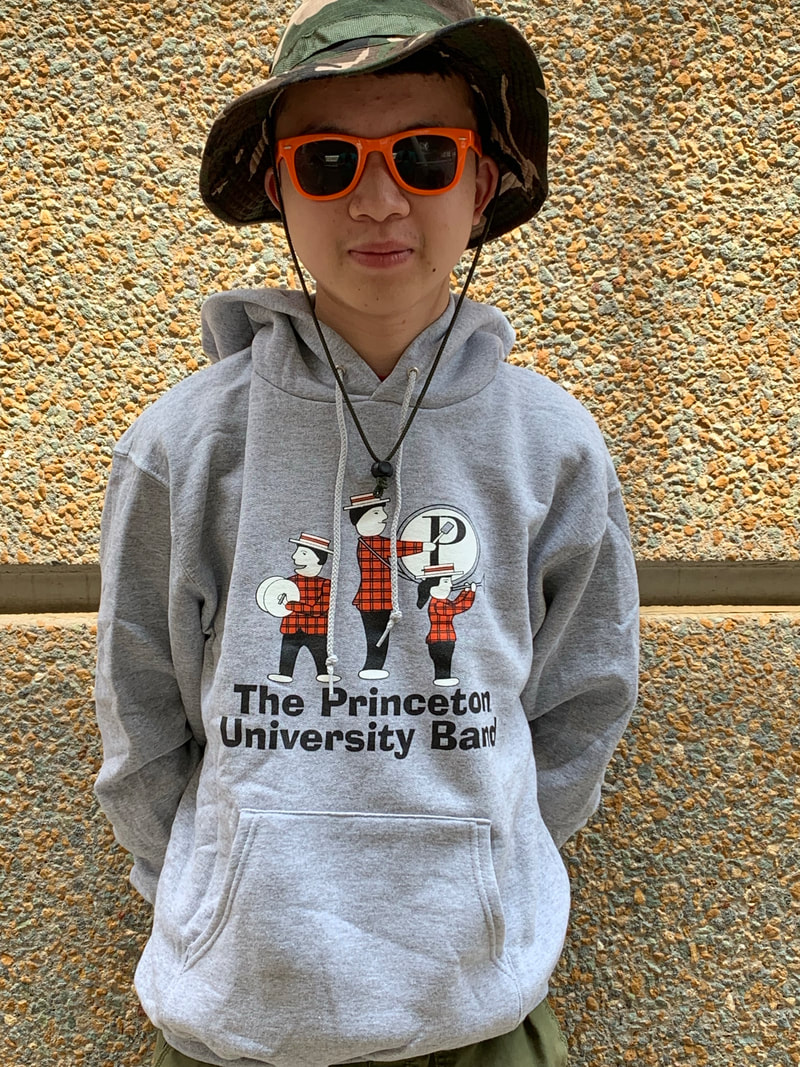 Gray sweatshirt with band logo of people playing instruments
